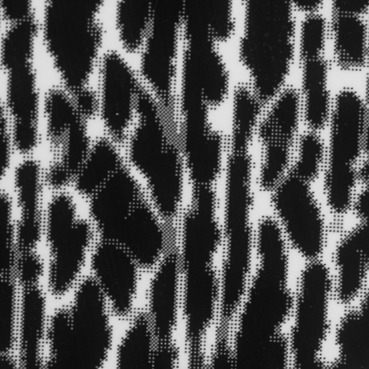Close-up of pixelated ABSURD black metal sticker artwork