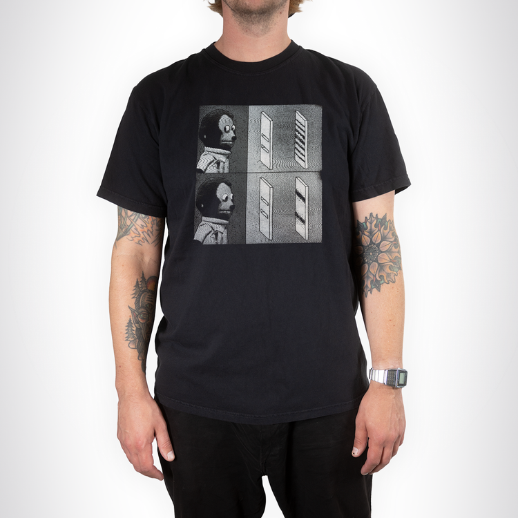 Model wearing the black Double Slit Shirt with a grayscale quantum experiment graphic