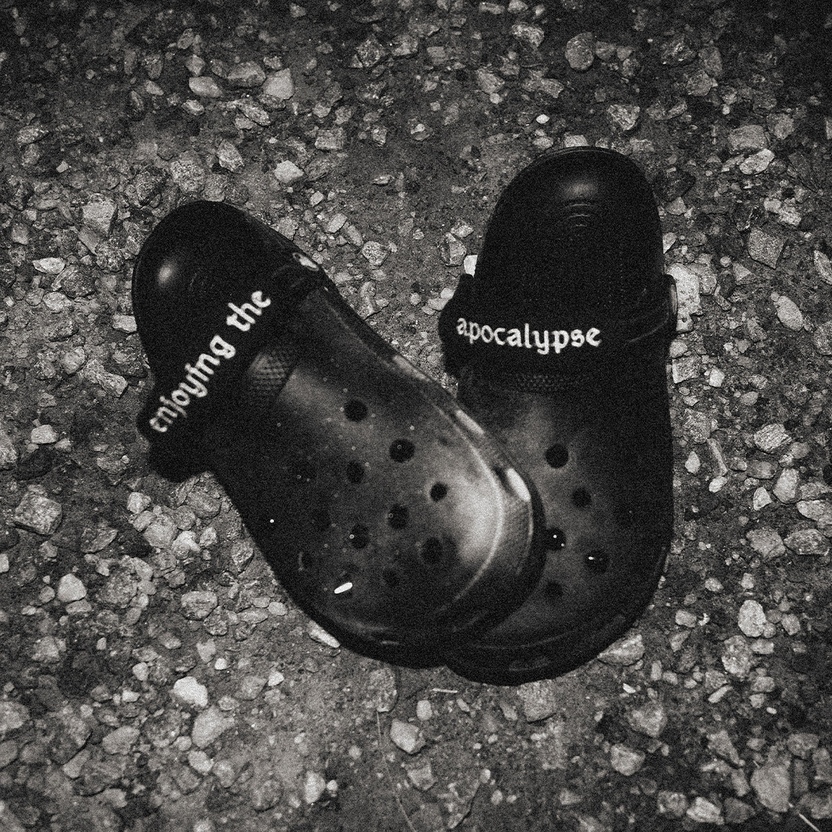 NIHILOCKS customized black Crocs with gunmetal spikes and embroidered wraps
