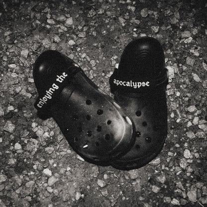 NIHILOCKS customized black Crocs with gunmetal spikes and embroidered wraps