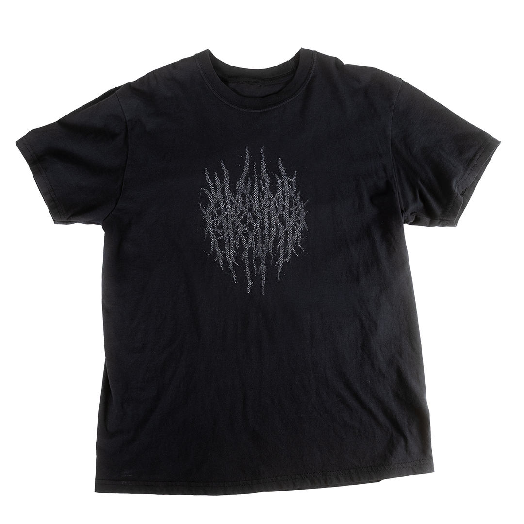 Front view of black Grim Swing shirt with subtle tonal print