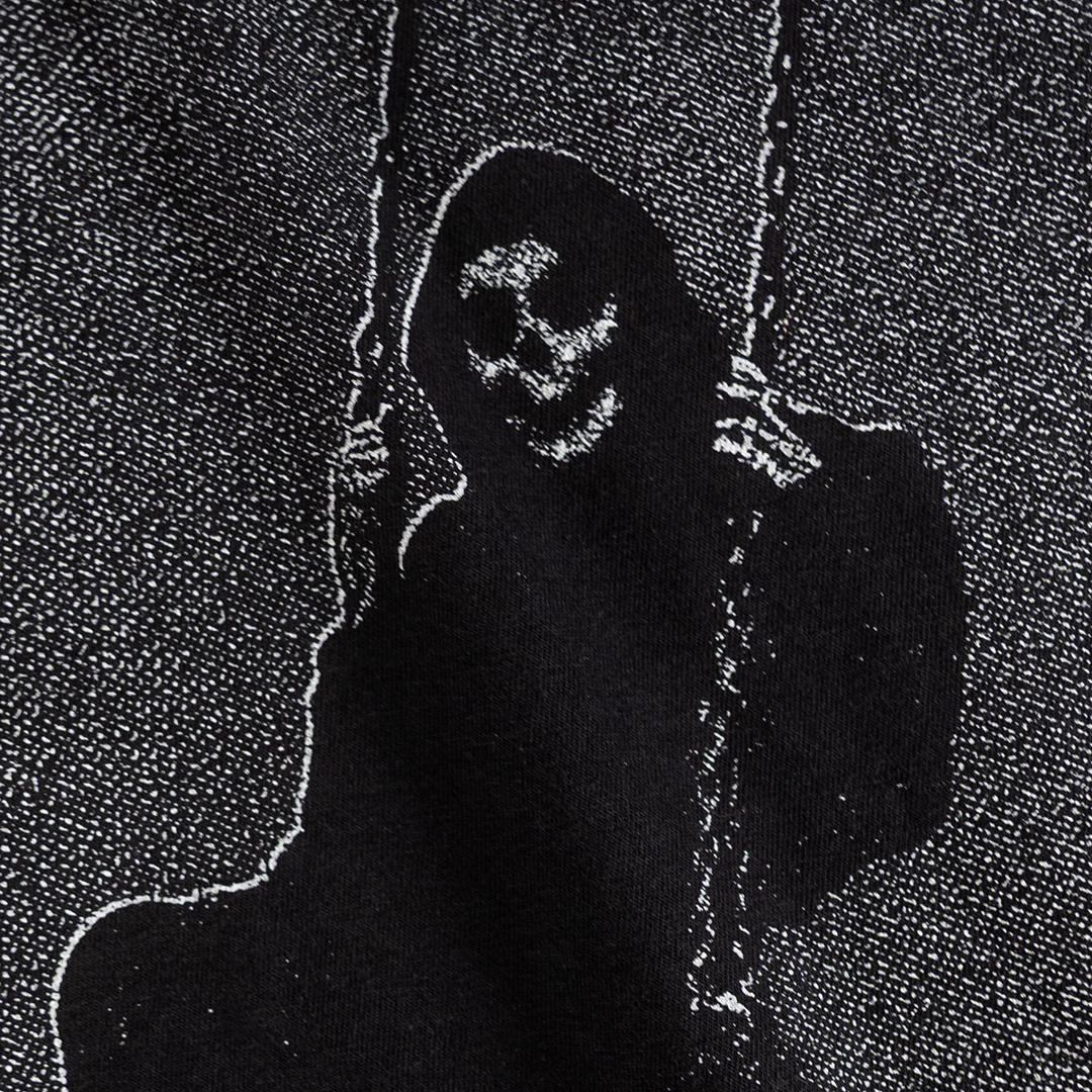 Close-up of the grim figure on a swing print