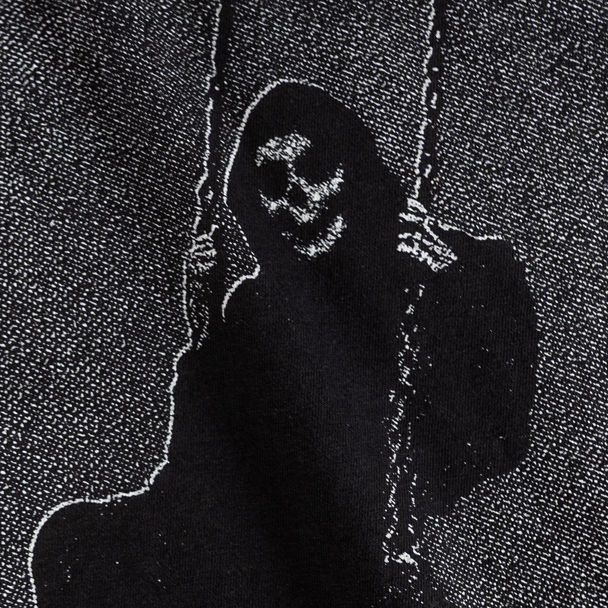 Close-up of the grim figure on a swing print