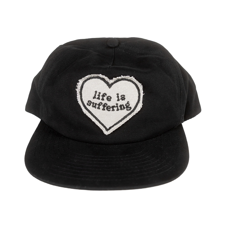 Front of black hat with a raw-edge Life Is Suffering heart patch