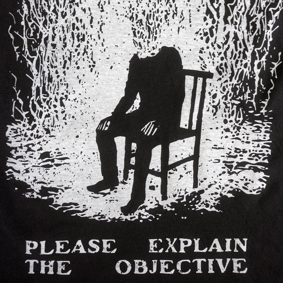 Close-up of seated figure and Please Explain the Objective print