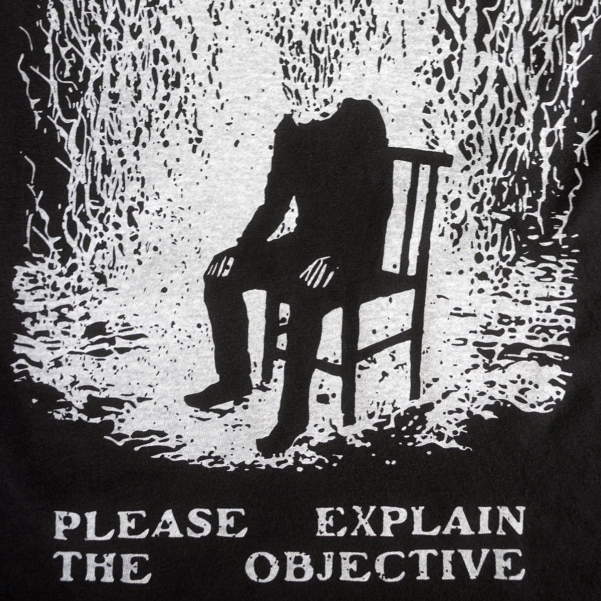 Close-up of seated figure and Please Explain the Objective print