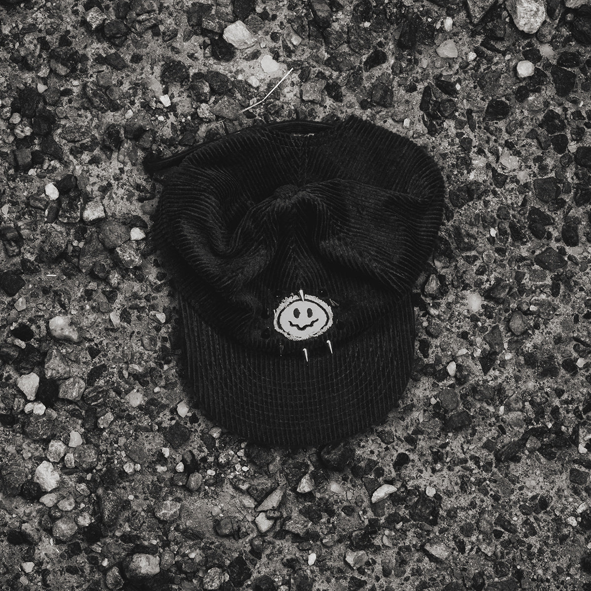 Smiley Corduroy Hat top view with gunmetal spikes