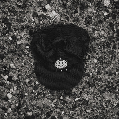 Smiley Corduroy Hat top view with gunmetal spikes